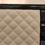 Curved Four-Door Sideboard with Quilted Upholstered Panels High-Gloss Burl Wood Veneer and Gold-Finish Metal Handles